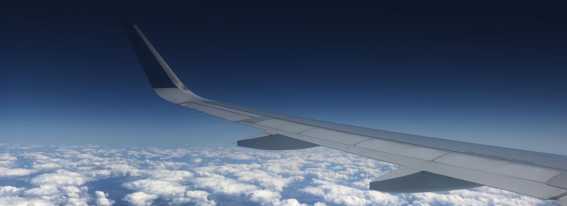 aeroplane wing in the clouds